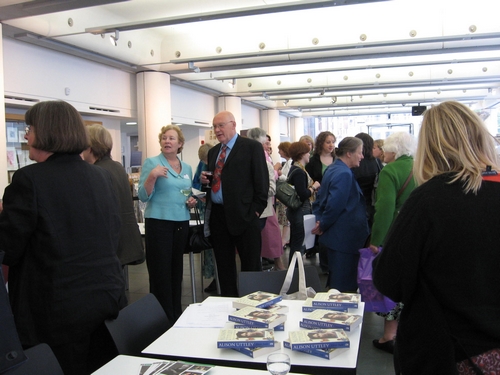 Guests at the launch, where copies of the book were on sale.